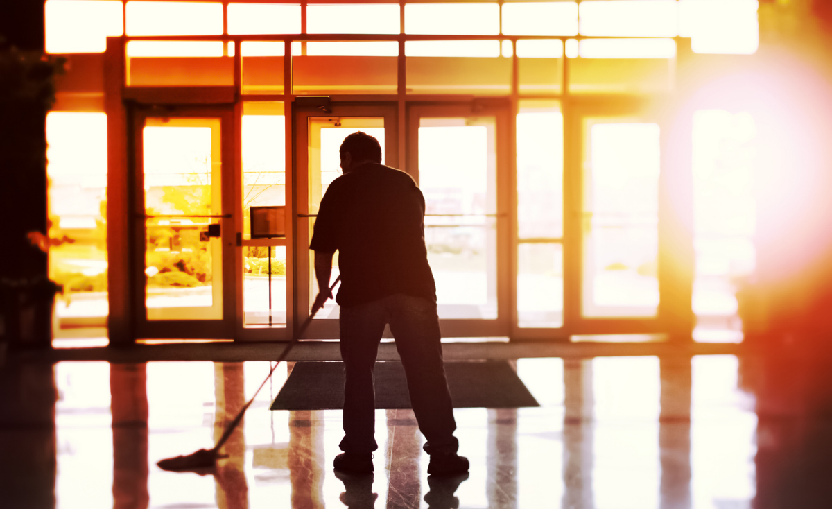 Worker cleaning office building