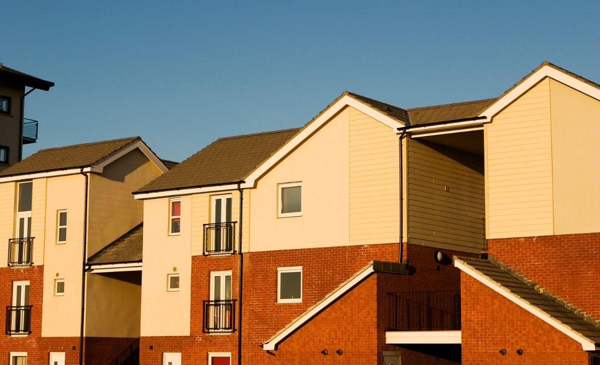 An image of apartment buildings in golden hour lighting.